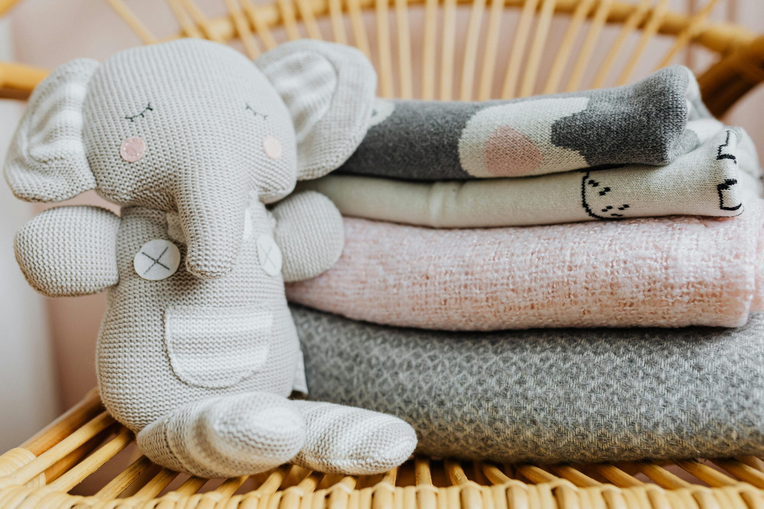 Stuffed toy beside blankets